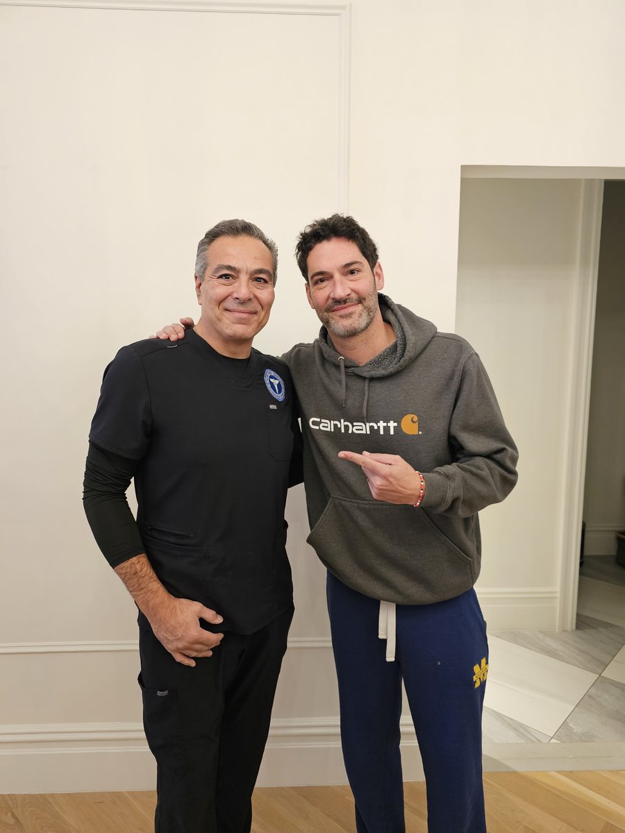 Bill Kakis (left), Vice President of Business Development at New York Cryogen, standing with a guest